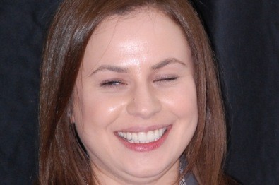Young woman with evenly spaced teeth