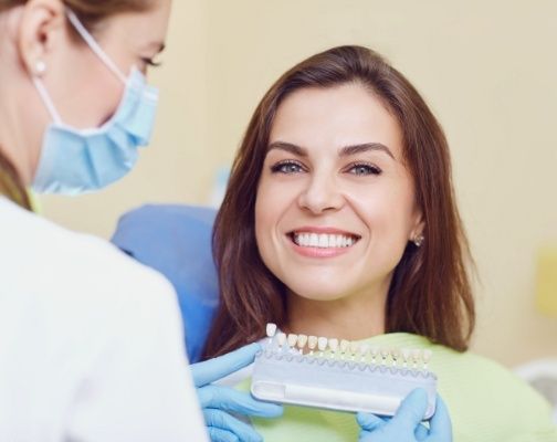 Dental patient grinning while at appointment for veneers