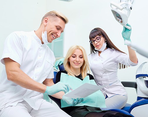 Young female listening to dentist 