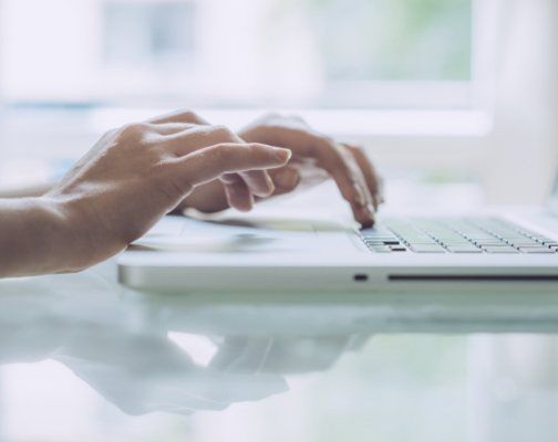 Person typing on laptop