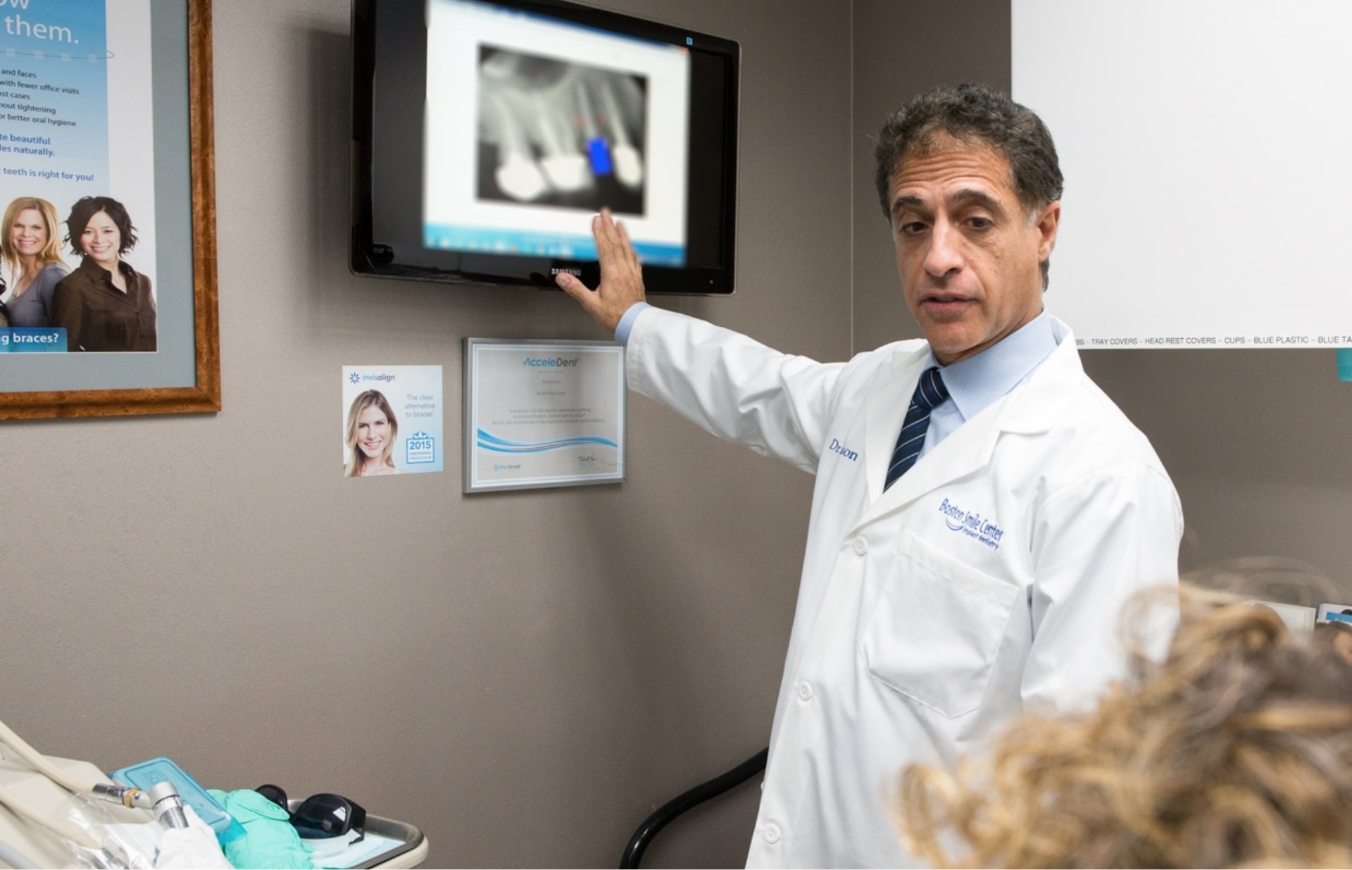Brookline dentist Doctor Sasson showing a patient their dental x rays