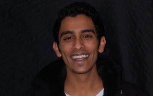 Smiling man in black jacket