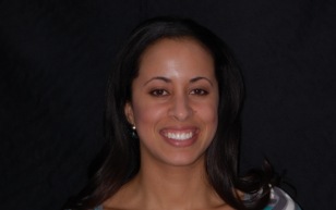 Woman with long dark hair smiling