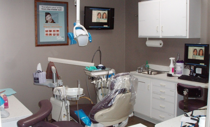 Covered dental chair in dental exam room