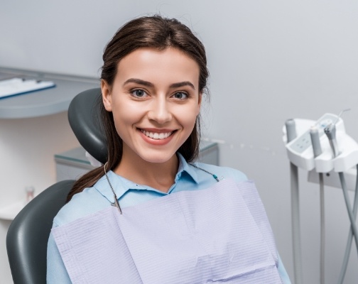 Young woman smiling in dental chair