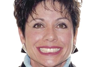 Close up of smiling woman with slightly flawed teeth