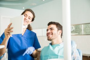 patient and dental professional discussing preview of Invisalign in Brookline