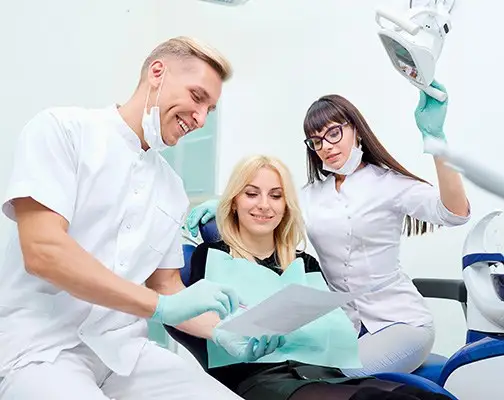 Young female listening to dentist