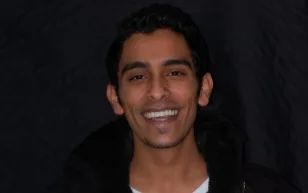 Smiling man in black jacket