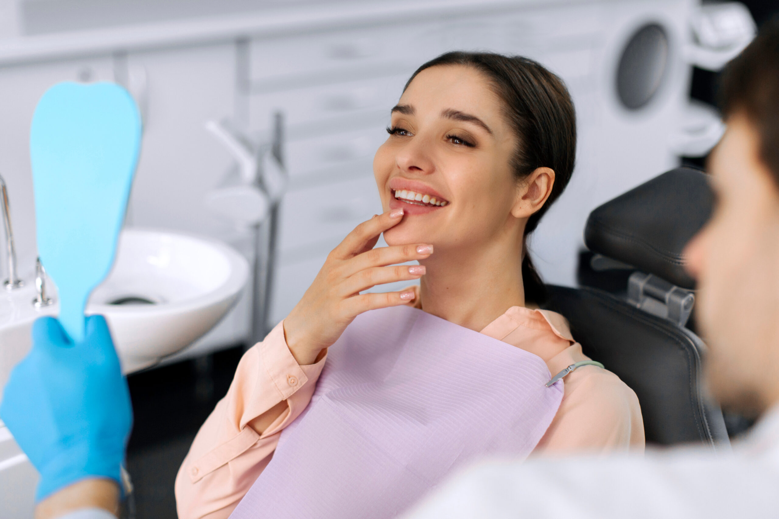 Dental patient receiving comfortable laser-assisted treatment